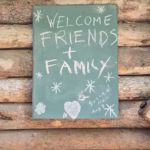 rustic welcome sign on wooden cabin in kelowna