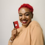 a woman holding a card