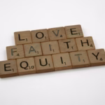 close up shot of scrabble tiles on white surface