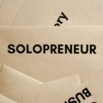 close up shot of a solopreneur text on an envelope