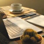 a laptop and a cup of coffee